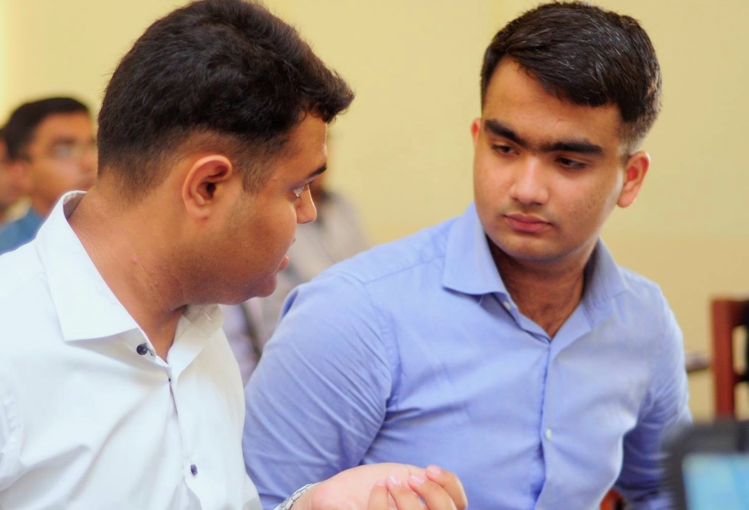 Muhammad Hamza Ali at work with a colleague